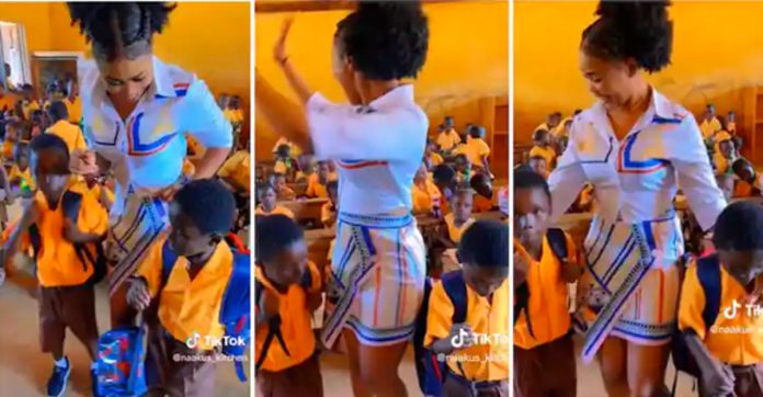 Beautiful Ghanaian teacher dancing with her Students in class, video is joyful