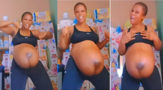 Happy pregnant mom dances with big baby bump in a cute video